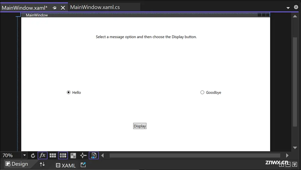 Screenshot of the Design window for Greetings.xaml showing a TextBlock control, two RadioButton controls labeled 'Hello' and 'Goodbye', and a button labeled 'Display'.